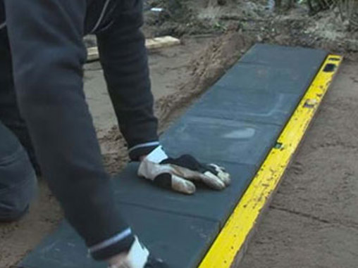 Læg belægningssten